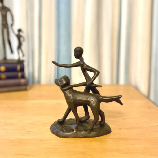 Runner with Dog Sculpture